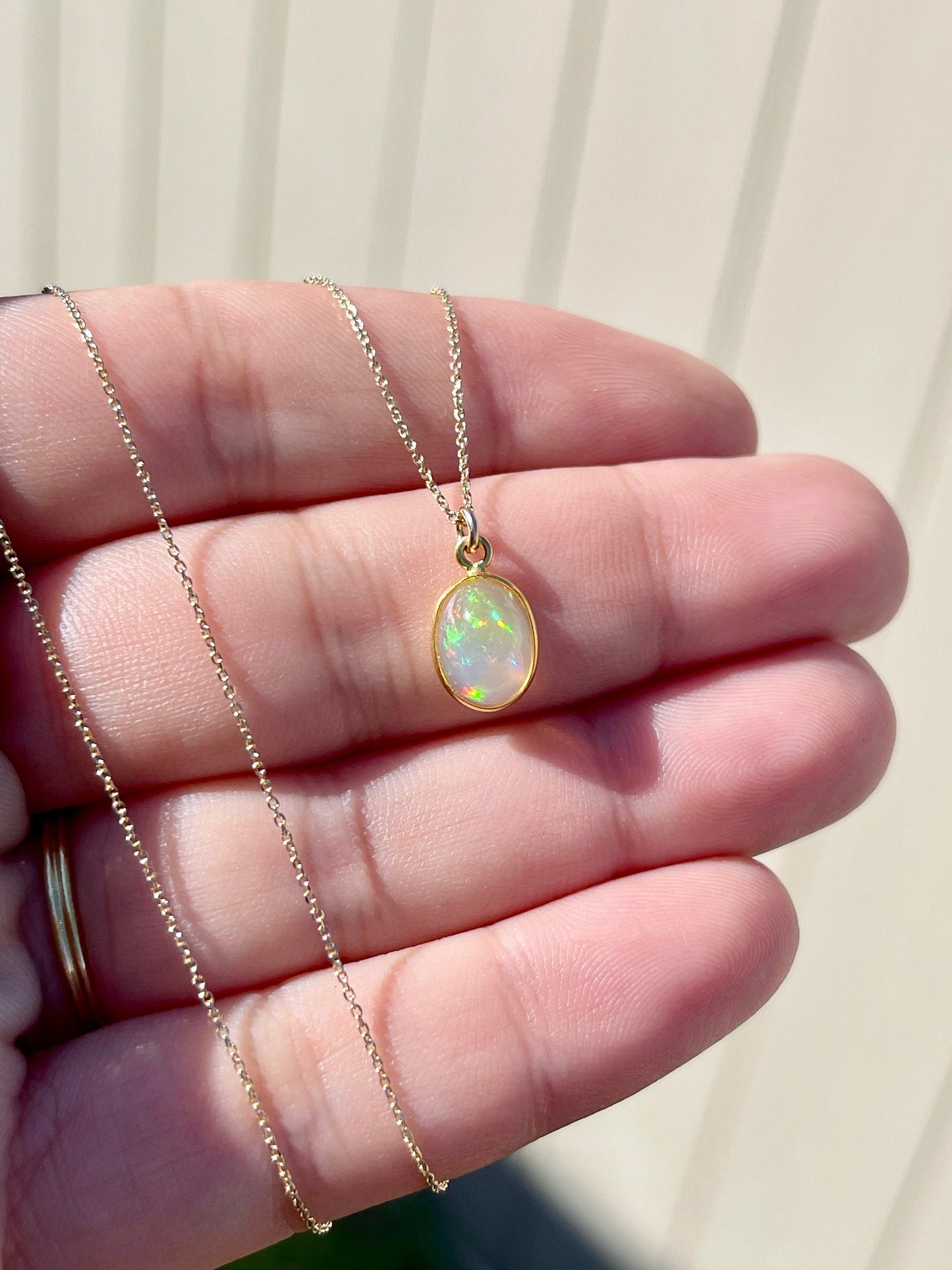 Tiny Ethiopian Opal Oval Pendant in Solid 14k Gold