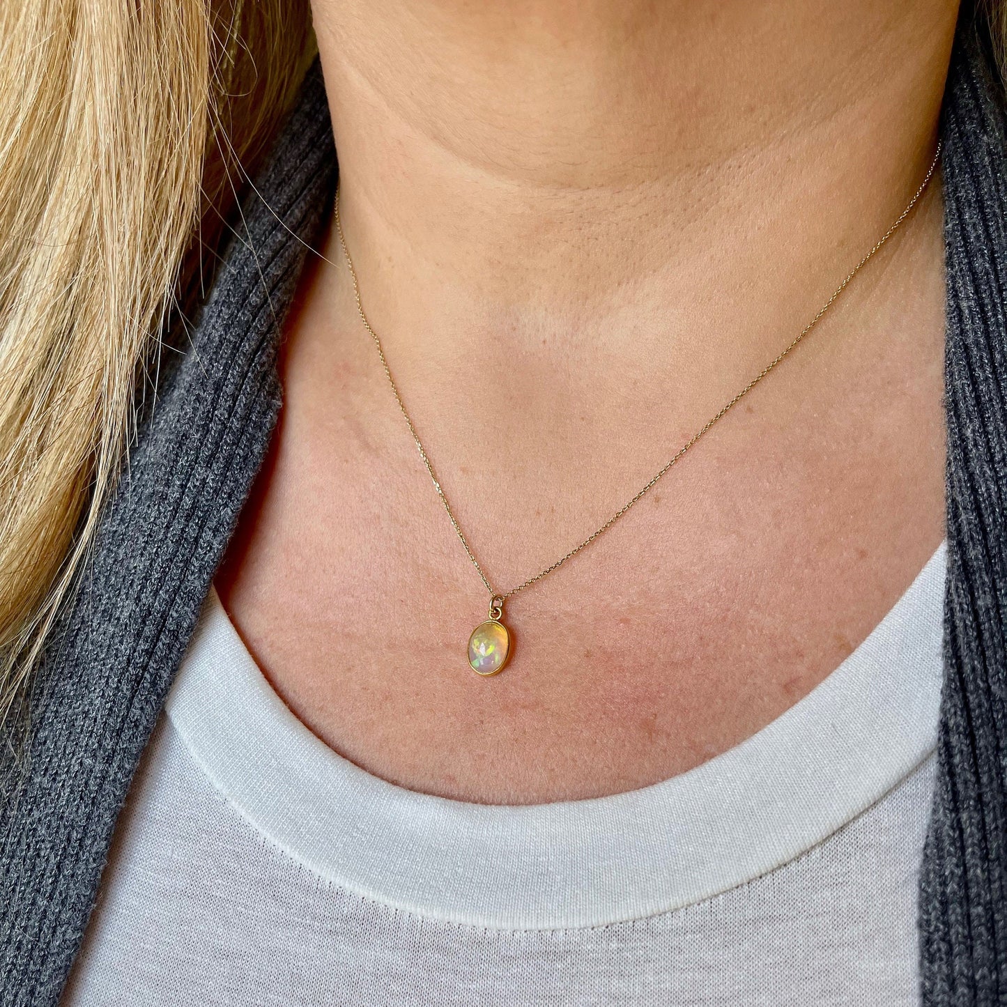 Tiny Ethiopian Opal Oval Pendant in Solid 14k Gold